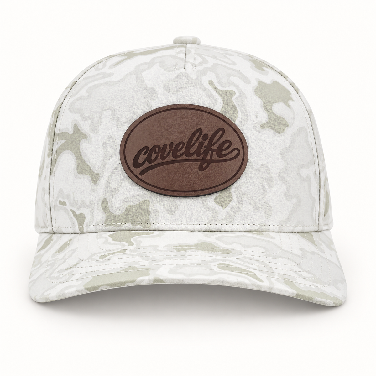A structured baseball cap with a light gray and off-white camouflage pattern, featuring a brown oval patch on the front with the brand name 'covelife' in black script.