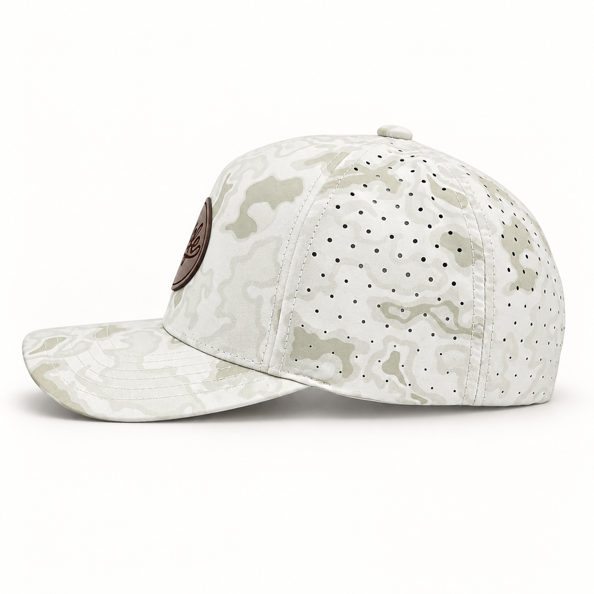 A white and light gray camouflage baseball cap with perforated side panels and a brown circular patch on the side, shown against a plain white background.