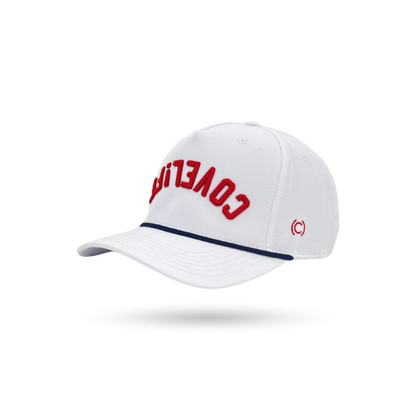 A white baseball cap with 'COVERED' embroidered in red on the front, a navy blue stripe along the edge of the brim, and a small red circular logo on the side, shown against a plain white background.