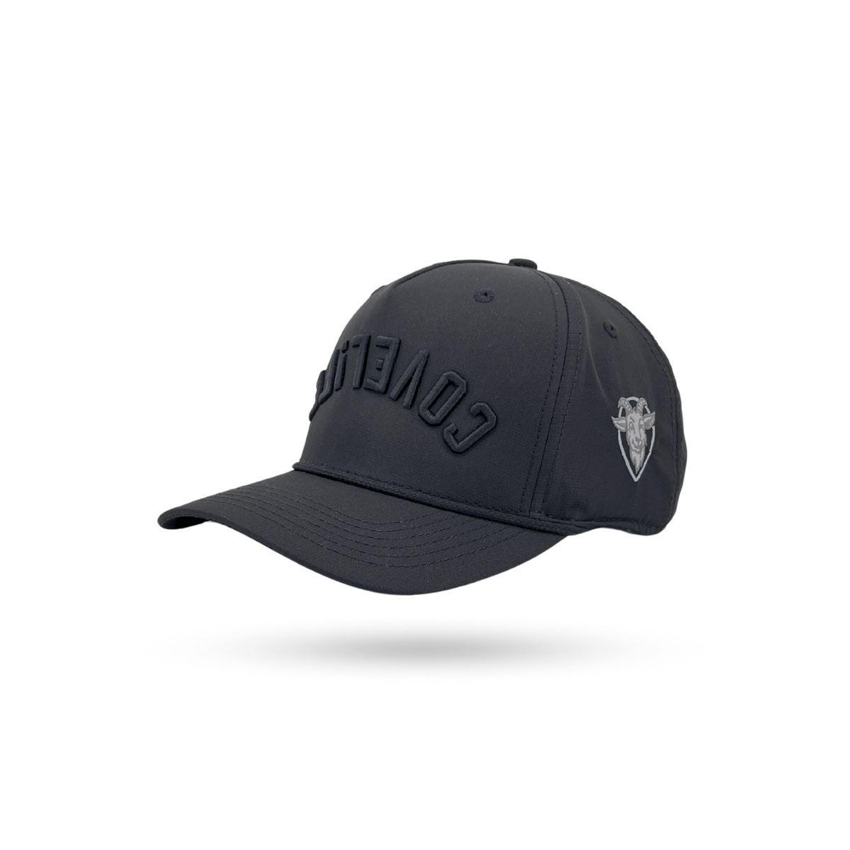A dark charcoal gray baseball cap with 'COVERT' embroidered in tonal black on the front and a small silver shield logo on the side, shown on a white background with a soft shadow.