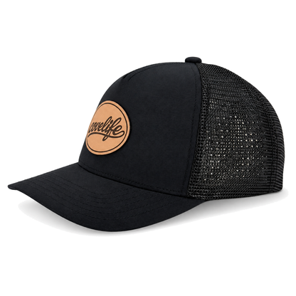 A blackCLASSIC MESH  hat with a curved brim, featuring a black front panel, a black mesh back, and a brown oval patch on the front with the brand name 'covelife' in script.