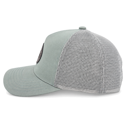 A sage green CLASSIC MESH  hat with a curved brim, featuring a light green front panel, a darker green mesh back, and a brown oval patch on the front with the brand name 'covelife' in script.