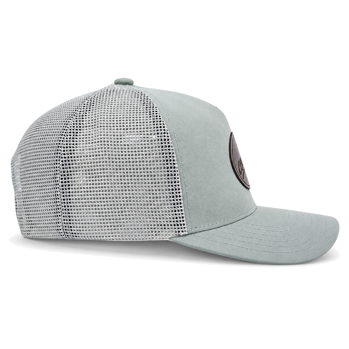 A sage green CLASSIC MESH  hat with a curved brim, featuring a light green front panel, a darker green mesh back, and a brown oval patch on the front with the brand name 'covelife' in script.