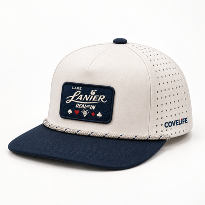 COVELiFE DEAL ME IN Lake Lanier performance rope cap in cream and navy, front three-quarter studio view.