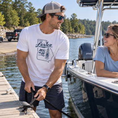 Man wearing the white COVELiFE DEAL ME IN UPF 50+ short-sleeve sun shirt while docking a boat.